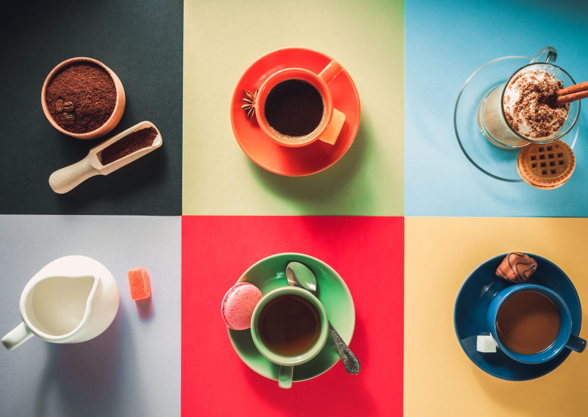 cup of coffee, tea and cacao at paper colorful background